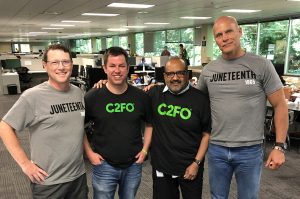 Jim Thompson, C2FO supplier relationship manager; Andy Kemp, C2FO director of training and development; Sanjay Gupta, C2FO president and COO; and Sandy Kemper, C2FO chairman and CEO; photo courtesy of Determination, Incorporated