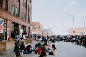 Jackie Nguyen speaks during a “Stop Asian Hate” vigil in March outside Firebrand Collective in the West Bottoms; Photo by Travis Young