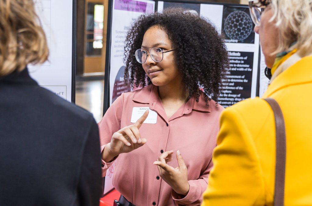 Students who showcase their innovative projects in the Project Lead The Way Senior Showcase share their ideas with visitors and volunteer mentors during the event. (File photo by Charles Maples)