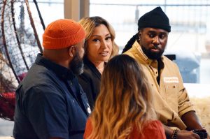 Deanna Munoz, Latino Arts Foundation, center, speaks during filming of the Community Builders to Watch interview special