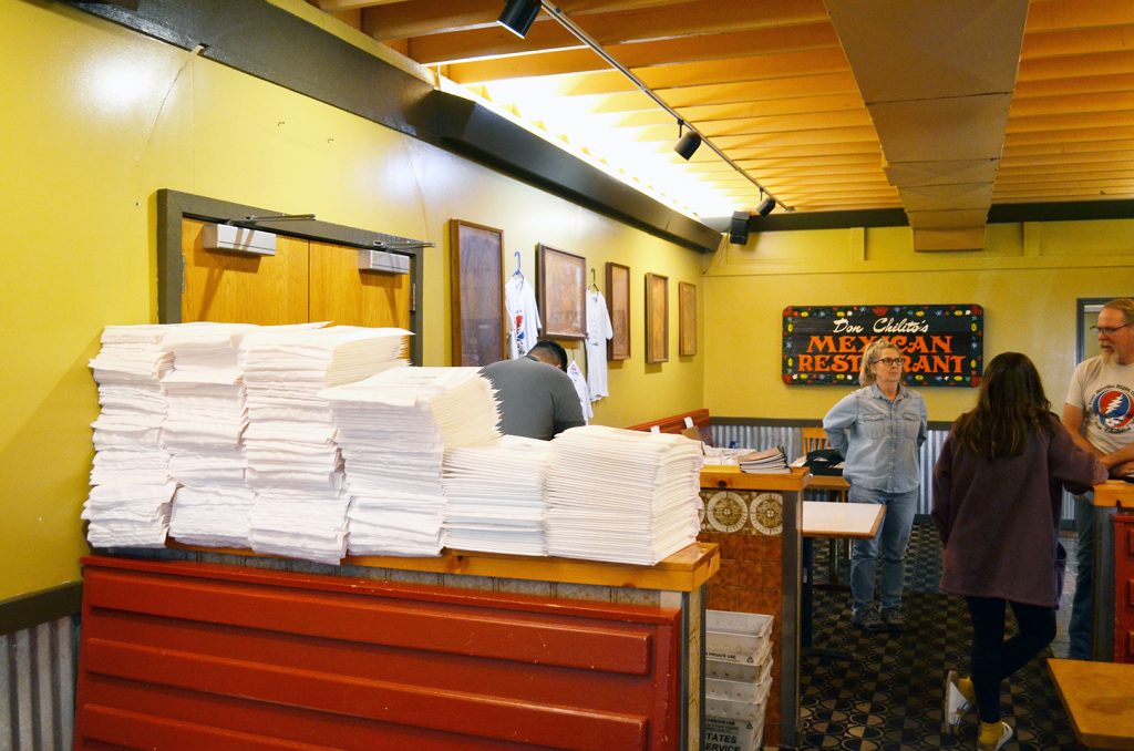 Stacks of addressed mailing packets sit ready Dec. 22 for already-purchased copies of "Don Chilito’s Secret Recipes book"