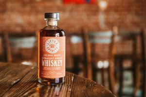 Lifted Spirits' Straight Wheat Whiskey, made with Torn Label’s House Brew