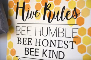 Inspirational signs are hung up around the apiary. The inspiration for the organization came from Detroit Hives.