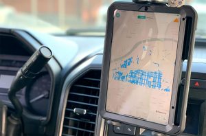 In years past, drivers have relied on old-fashioned maps to guide them along their routes. A new technological upgrade is designed to make their jobs easier. (Emily Wolf/The Beacon)