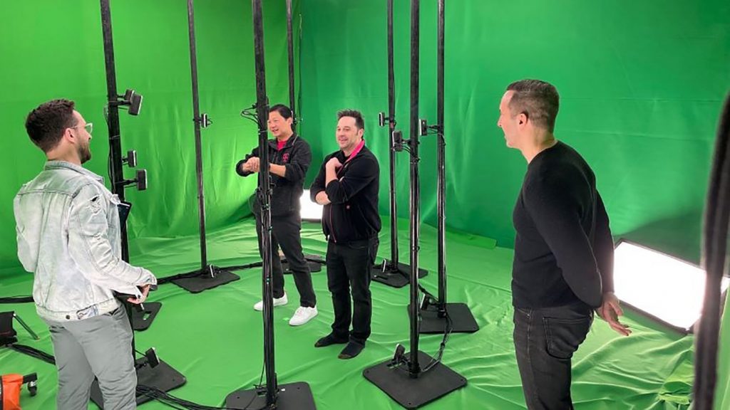 John Saw, T-Mobile’s executive vice president of advanced and emerging technologies, (second from left) and team in a studio surrounded by cameras capturing volumetric images to create holograms displayed on mobile devices. (Courtesy | T-Mobile)