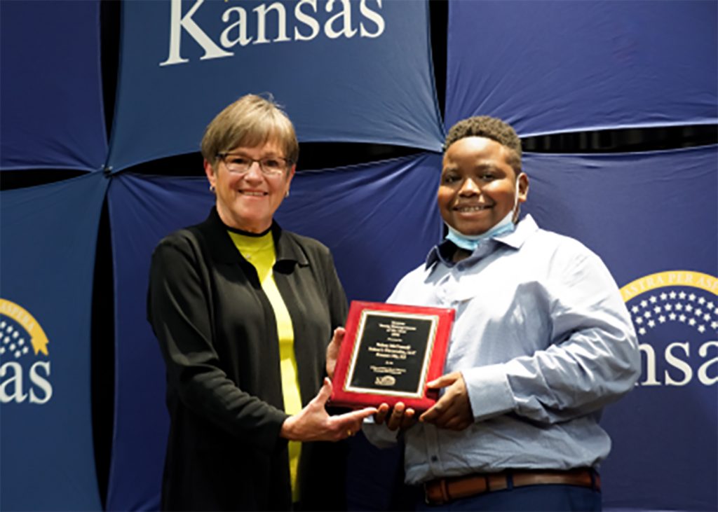 Kansas Gov. Laura Kelly honors Nelson McConnell in October with the State's young entrepreneur award