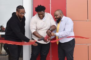 Co-founders Cornell Gorman, Christopher “LOKC” Stewart, and Brandon Calloway, Generating Income For Future Generations (G.I.F.T.), cut the ribbon of the nonprofit's new business center on Prospect Avenue