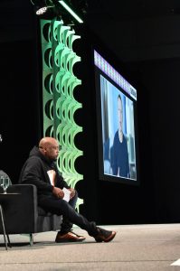 Daymond John, founder and CEO of FUBU and star of ABC’s “Shark Tank,” speaks with Mark Zuckerberg during SXSW