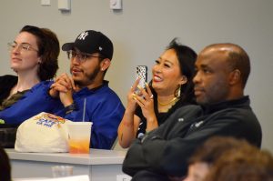 Jackie Nguyen, founder and owner of Cafe Cà Phê, records the announcement of the coffee shop's first-place win in the James and Rae Block Kansas City Startup Awards at the Regnier Venture Creation Challenge