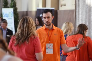 Mitch Case, More Than A Meal, talks with Deb North, Yes! Athletics, during the Chamber's Small Business Showcase at Union Station