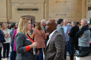 Melea McRae, Crux KC, a 2021 finalist for the Mr. K Award, speaks with Jamie Grayson, People of All Colors Succeed (POAC), during the Chamber's Small Business Showcase