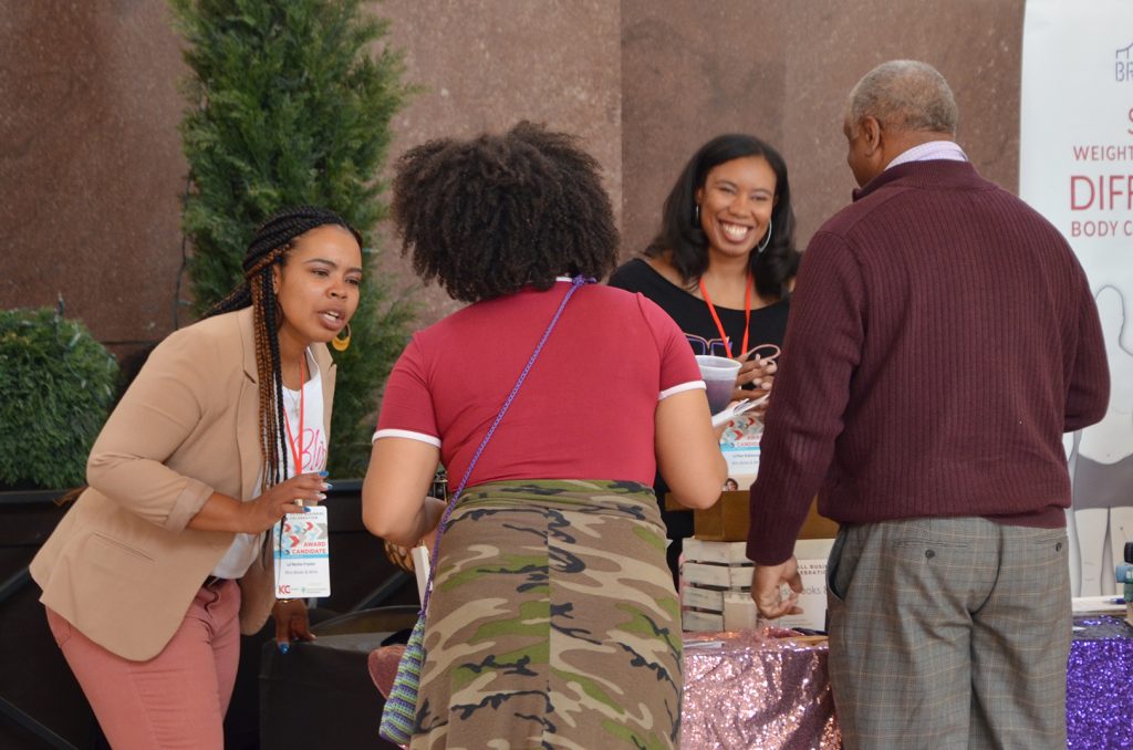 La’Nesha Frazier and La’Nae Robinson, Bliss Books and Wine, speak with event-goers April 21 during the Chamber's Small Business Showcase at Union Station