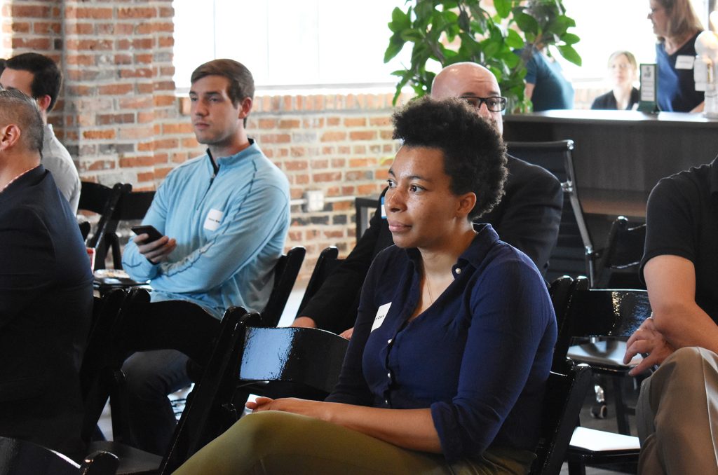 Charlotte Clark watches pitches at the Futures Group during the Comeback KC Ventures Innovation Showcase