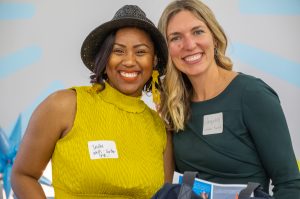 India Wells-Carter and Jacqueline Erickson Russell, Social Impact Advising Group, pose together Tuesday during a launch event for the LaunchKC Social Venture Studio