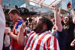 Fans react June 16 at Power & Light as news breaks that Kansas City will host during the 2026 World Cup; Startland News photo