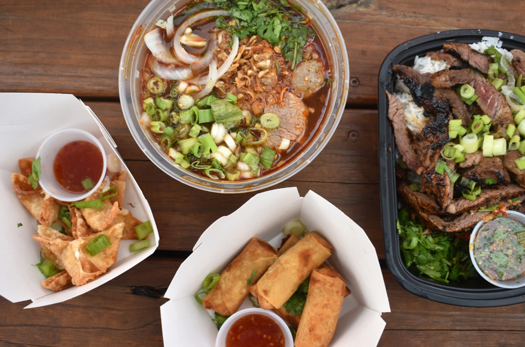 Four of Thaiger's five menu items: crab rangoon, lao spicy pho, egg rolls, and ribeye steak bowl