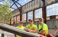 ‘Neon Alley’ turning on 40 historic KC signs at Pennway Point, lighting the way to new entertainment district